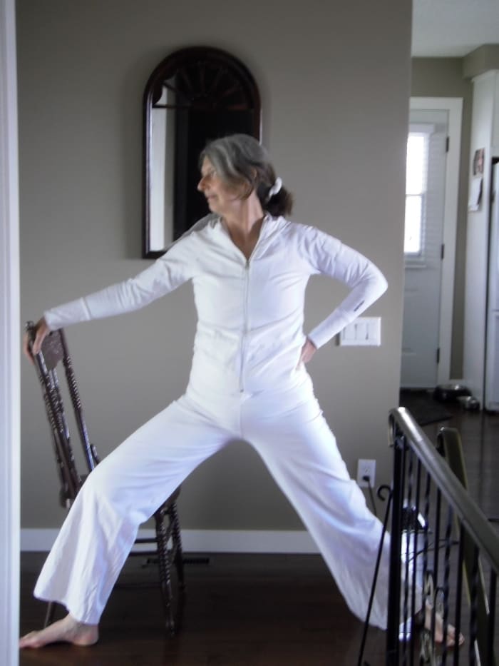 Warrior II strengthens the legs and balance. Arms can be extended in line with the shoulders in the classic variation, but in late pregnancy many women find it challenging to support the weight of the baby and of the arms.