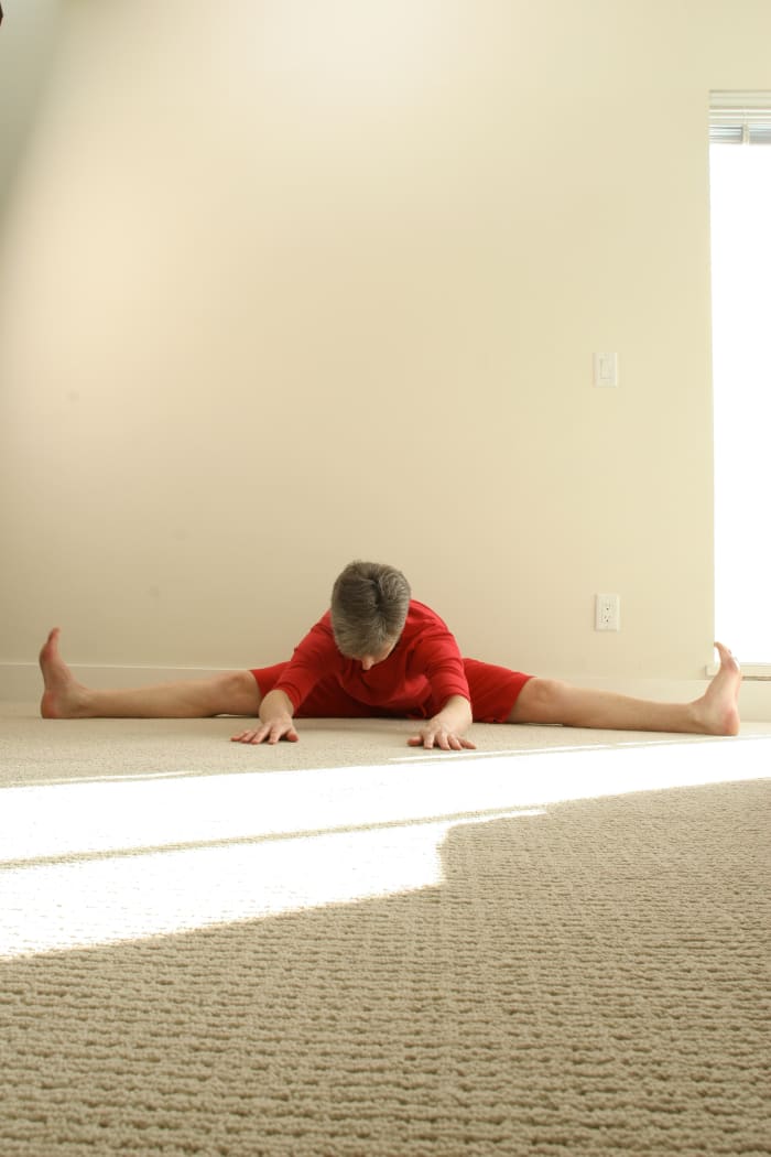 Come forward into the pose as far as feels comfortable. Some women prefer to bring hand on hand under their forehead and rest on the seat of a chair for a gentler variation.