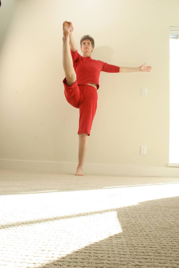 Hand to Toe Posture, or Hastapadmasana, is a challenging standing pose that requires strength, balance and hip flexibility. A simpler variation can be done lying on the back, and using a strap around the foot.