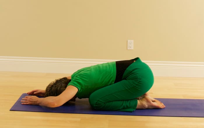Rest in Child Pose to allow the blood pressure to equalize and to ease tension from the neck. Then lie on your back in Svasana Corpse Position.