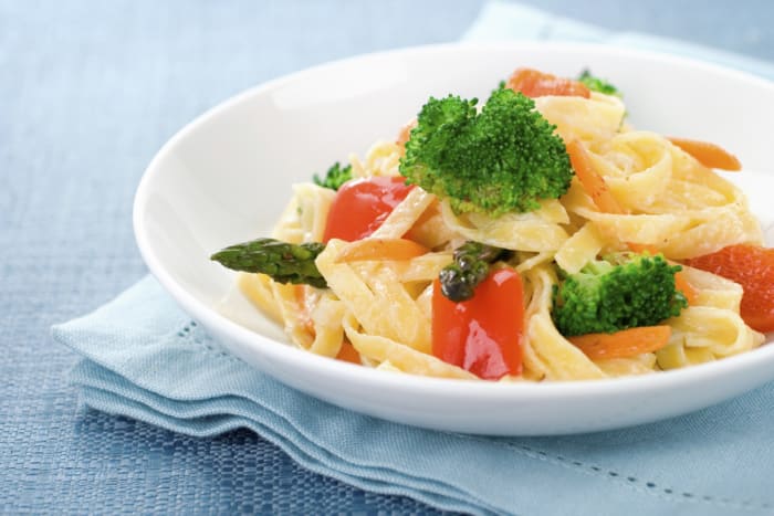 Very frequently, the vegetarian option will be some sort of pasta. If they have a whole grain option, go with that.