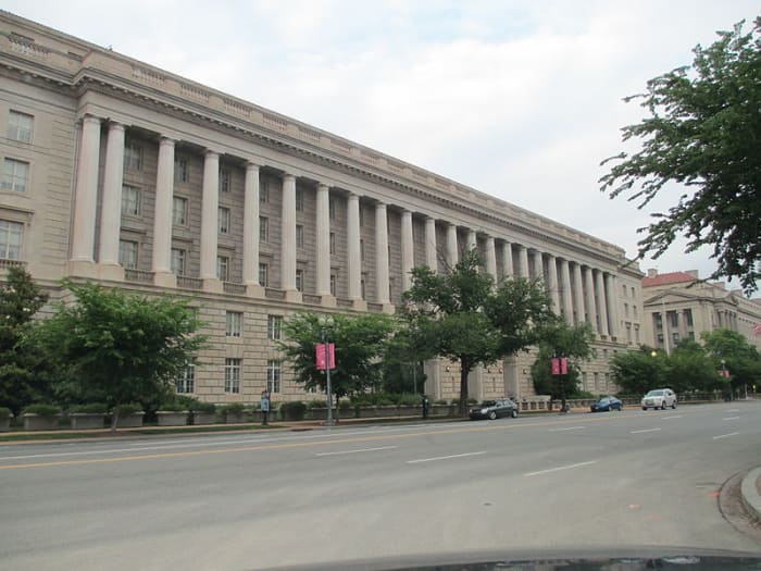 IRS building in Washington D.C. People against tax rises for the rich argue that government departments already waste much of the tax revenue raised. Increasing taxes would just create more waste and disincentivize investment.