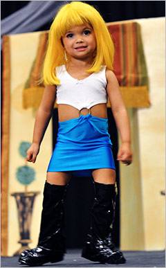 This little prosti-tot was dressed up to look like a little "Pretty Woman" for a pageant shown of Toddlers and Tiaras.