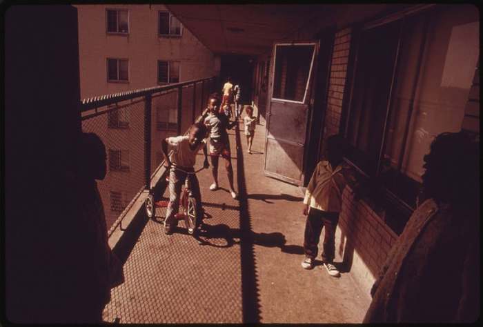 Residents on one of the balconies of the Robert Taylor homes, a low income, high-rise apartment building in Chicago.