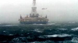 US Coast Guard helicopter rescuing Shell Oil personnel from the Arctic drilling rig Kulluk. Image courtesy youtube.