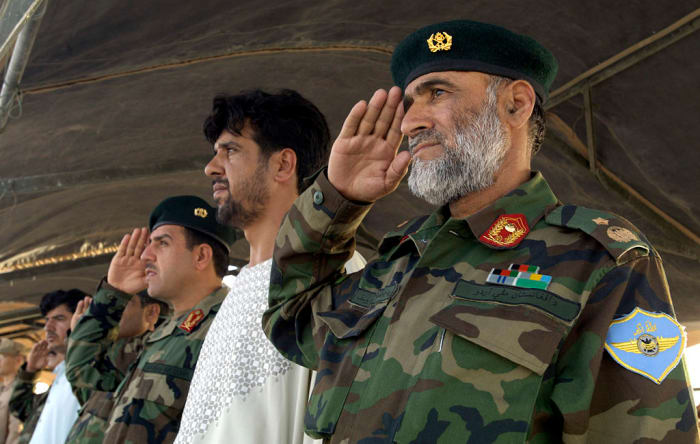 Afghan National Army Air Corps Brig. Gen. Mohammad Yousaf renders honors July 31, 2007 during a historic change-of-command ceremony at Kandahar Air Field, Afghanistan