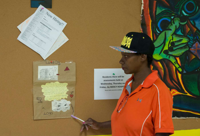 A view of a poetic artist residing inside of the school building housing the community of Tent City West