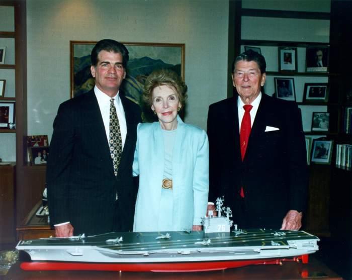 Former President Ronald Reagan and First Lady Nancy Reagan, as well as Newport News Shipbuilding Chairman and CEO Bill Fricks stand behind the model of the aircraft carrier USS Ronald Reagan (CVN-76).