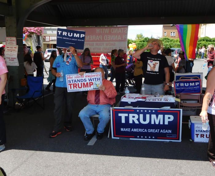 Gay white men campaigning for an anti-gay candidate at at Bellingham Pride Festival, July 11, 2016. Photo by Robert Ashworth, CC 2.0