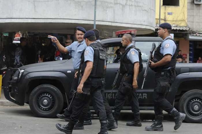 Police officers in the favela of Rocinha. Brazil suffers from high crime and murder rates.