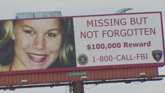 FBI billboard offering a $100,000 reward for information leading to the whereabouts of Rachel Cooke who vanished January 10, 2002.
