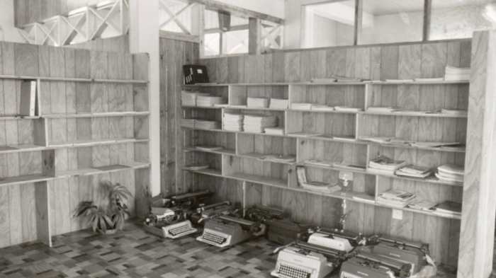 And we finally got shelves! Note the typewriters in use then. We only had one computer—donated by IBM for use by our accountant.