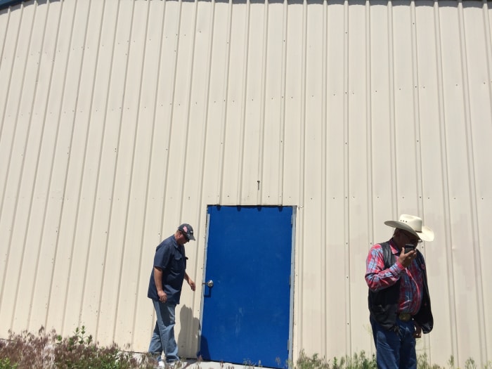 We checked out this abandoned structure in the heart of Wounded Knee. Brian is on the left. A local who unlocked the building for us is on the right.