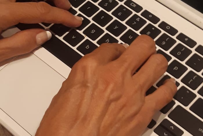 typing fingers laptop