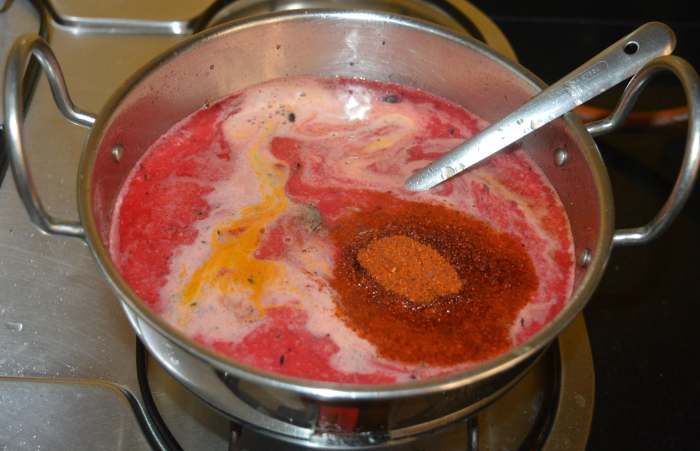 Step three: Add about 8 cups of water. Let the mixture come to a gentle boil. Add turmeric powder, tamarind pulp, jaggery powder, rasam powder, and salt. Allow the mixture to boil for 5 minutes.