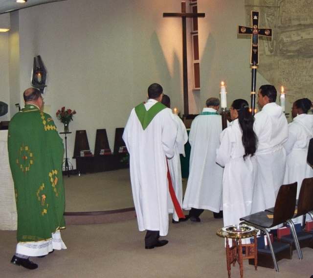 Celebrants and acolytes approach the altar to begin a special service at Saint George's in Washington, DC.