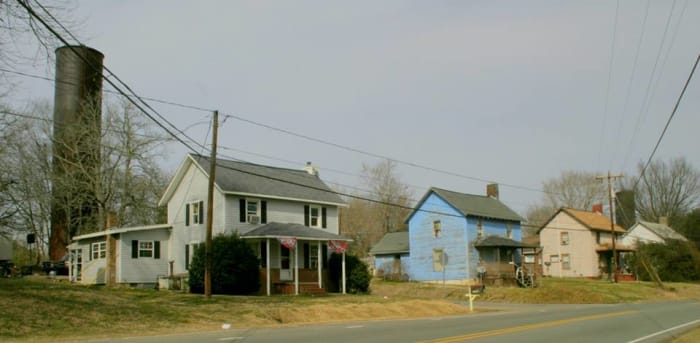 Part of a North Carolina mill village. These larger homes would have been rented to supervisors in the mill.