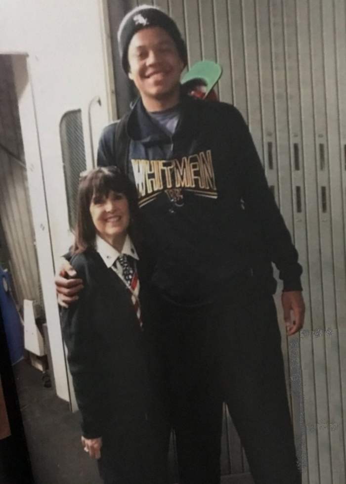 At 5 feet, I love having my picture taken with tall people - with 6'9" college basketball player