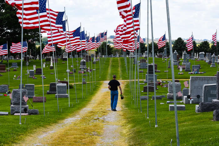 This small-town cemetery in Lowden, Iowa has an incredible display of American flags. It is a must see.