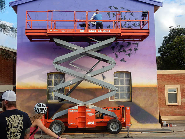 A scissor lift is one way to work safely at heights above the ground that might be shaky on a ladder