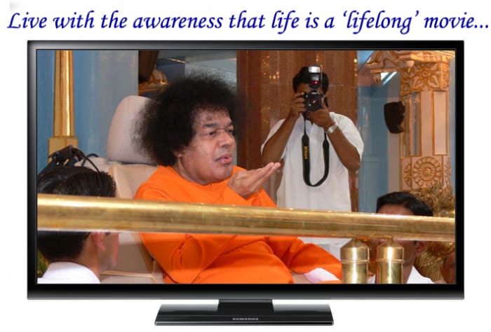 In the television: A beautiful moment when Swami materialized vibhuti and 'blew' it on all the students seated in the front.