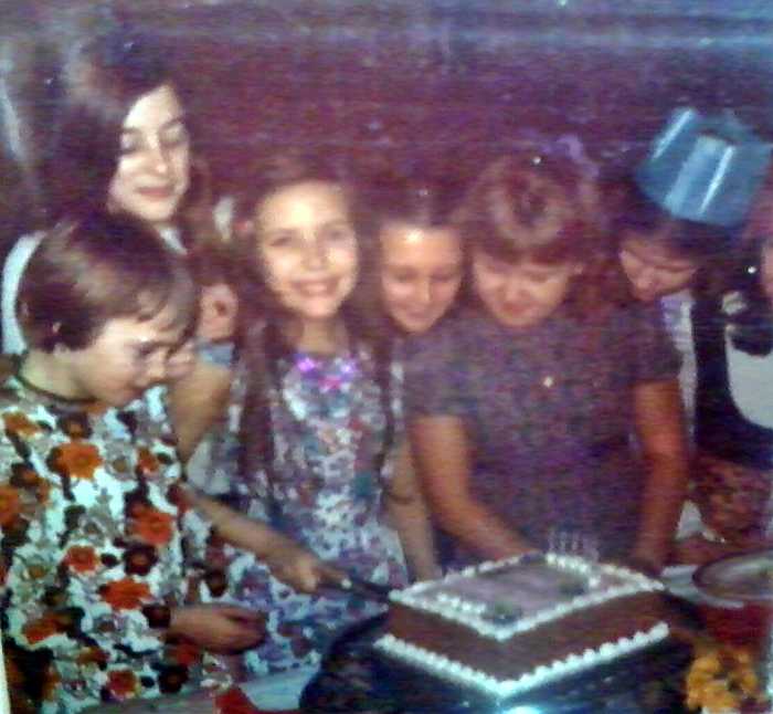 Me cutting my cake as I celebrated my 11th birthday, just before I started my first term at grammar school. I was such a shy little thing.