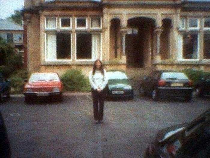 Me standing outside my old classrooms for the final time in the year 2000, when the school closed down.