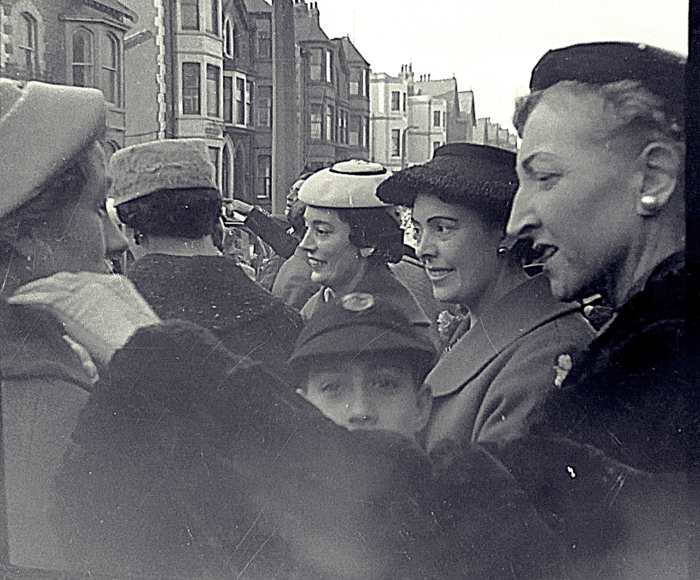 The wedding guests wave off mum and dad as they embark on their honeymoon. Dad's older sister Olive is in the white hat; next to her their sister Josie and in front my brother Eric.