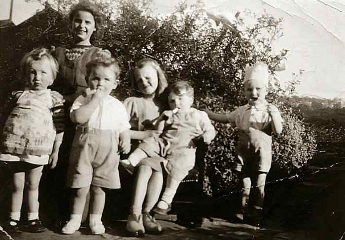 A family photo from around 1949: On the right is my brother Eric as a toddler, with my mum's cousins Shirley (standing at the back); Sandra (sitting on the bench) and Paul (standing at the front). The other two were neighbours' children.