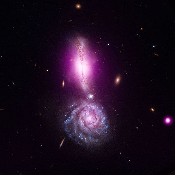 Exclamation point formed by galaxies headed for a merge that will take millions of years