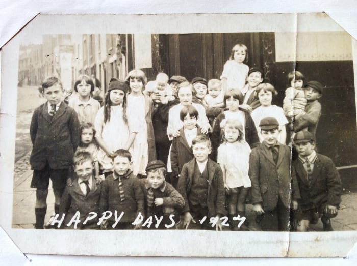 Neighbourhood children outside the pub at the entrance to Fleet Street