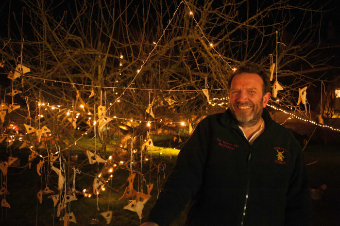 Nigel Smith, landlord of The Fleece at Bretforton, with the orchard in the background.