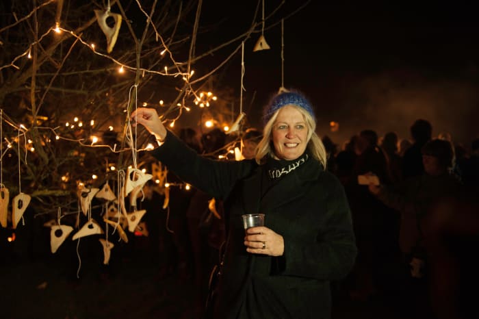 The toast is hung from the branches of the apple trees.