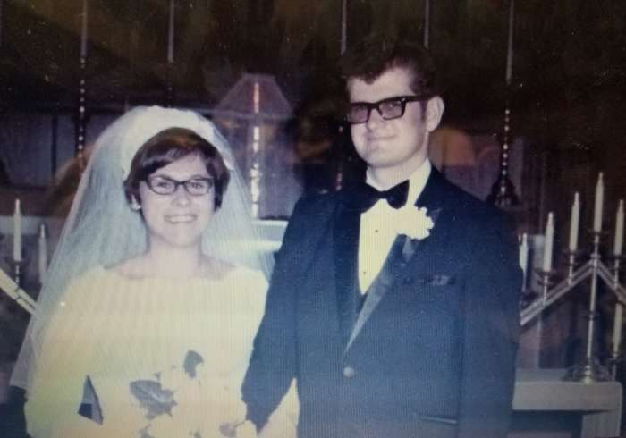 My mom had a Cathedral length train, an orchid corsage in the middle of her bouquet and a wedding cake that was shaped like a Cathedral. She got married Labor Day weekend, so she had her attendants in forest green, purple, fuchsia, and copper.