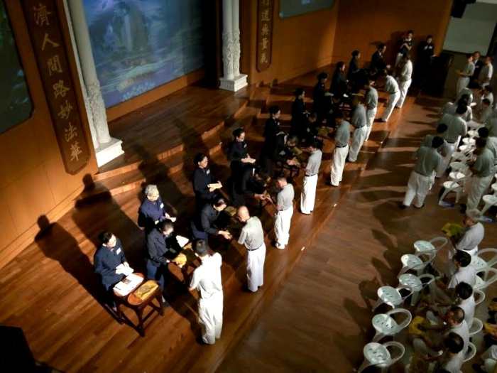 Good Guy, 2nd from left, receiving confirmation as a Tzu Chi "Trainee Commissioner".