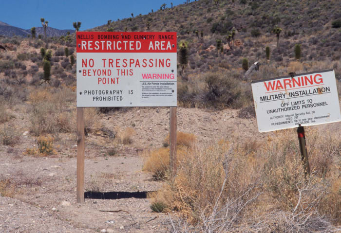 Each road that takes you to Area 51 are these serious caution signs that say that if you trespass, you will be shot.