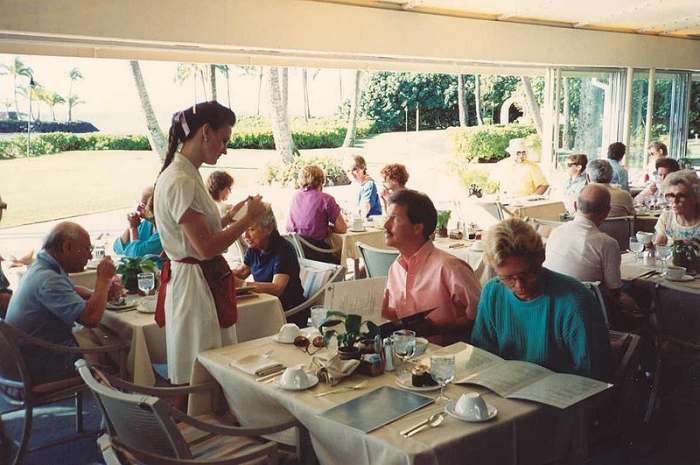 Waitress taking an order at Kahala Hilton Hotel, Hawaii, USA.