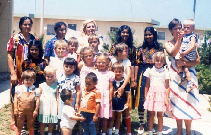 Pic4: Snapping with the children with their mothers at a birthday party including my sisters and myself
