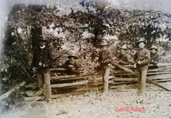 What looks to be Soldiers from the Spanish American War, holding bayonets while posing for the photo. April of 1898 makes it probable for young William to be the one who fought in this war.