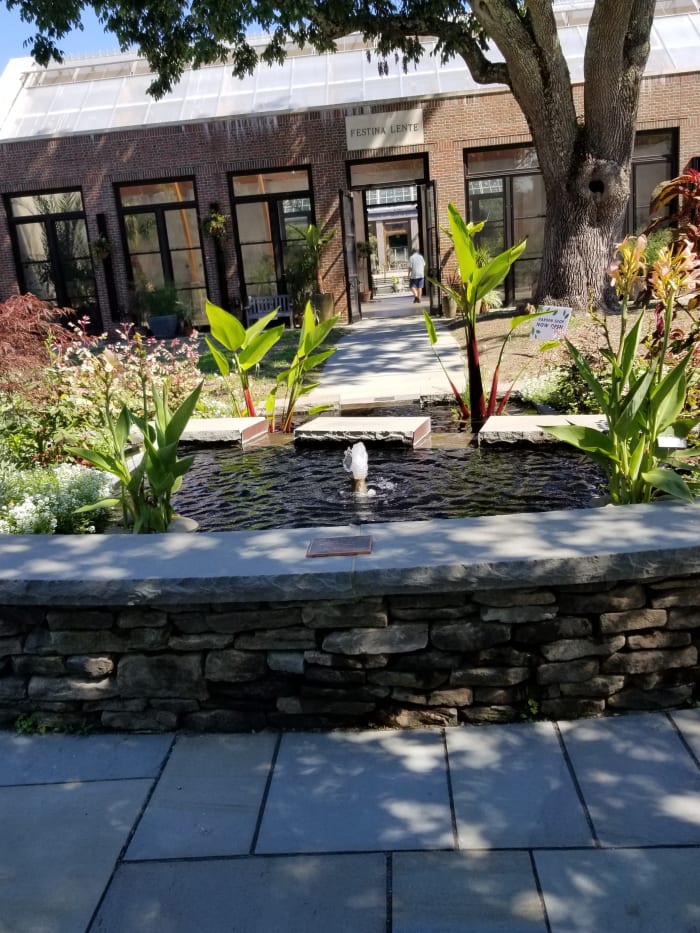 Fountain at the "Garden Within Reach," which was built for accessibilty by all guests. From behind the fountain you can see straight through the educational building to the other side, including the Winter Garden between the 2 wings of the building.