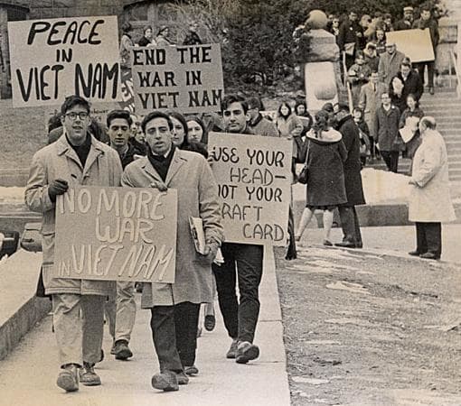 Student protesters marching down Langdon Street at the University of Wisconsin-Madison during the Vietnam War era in 1965.