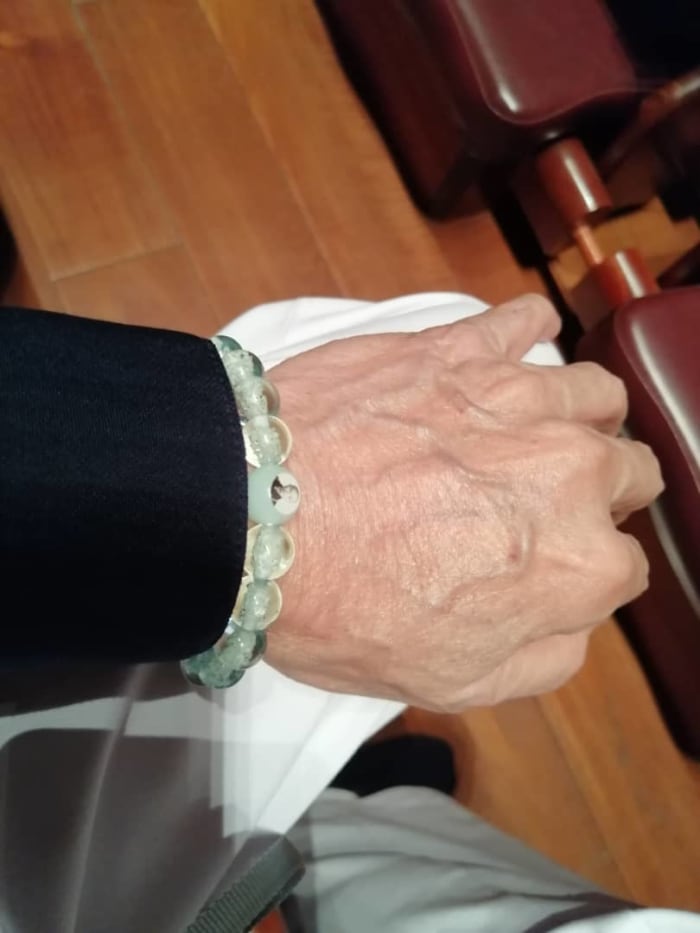 The glowing-beads bracelet, with Master's image, a spiritual gift from the Master.