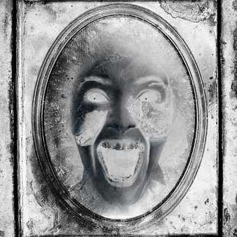 Antique mirrors are objects to approach with care. One can never know what events from the past might be trapped behind the glass.