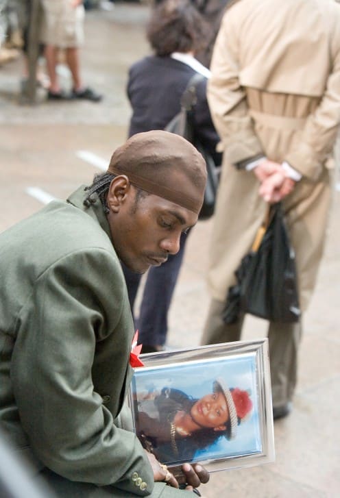 Ground Zero, NY, September 11, 2007 -- Ground Zero mourner reflects on the death of a loved one during 9-11 Memorial Service. Andrea Booher/FEMA