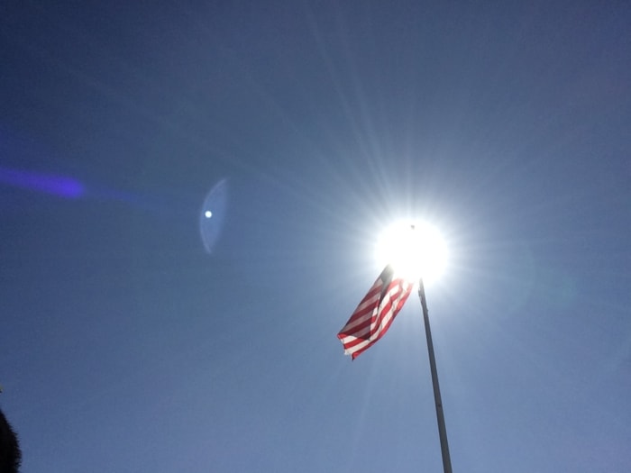Taken by Kevin C. Davison at Seaside, Oregon Coast. American Flag Illuminated by the Sun.