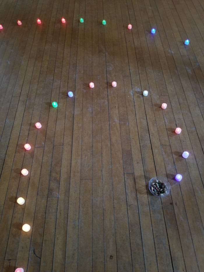 At the center there are gifts of stones and shells to bring back to us the memory of our time spent in Sacred Space.