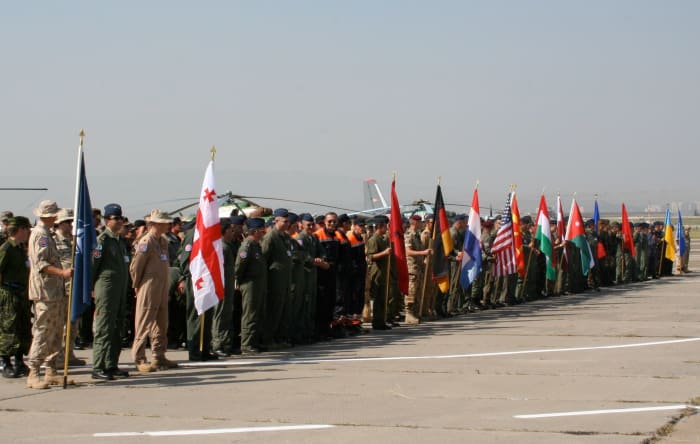 One example of security cooperation is the Partnership for Peace. Multinational military exercises inlcude examples like the Cooperative Archer in Tbilisi, Georgia, in July 2007 with 500 servicemen from four NATO members, eight PfP members, and Jorda