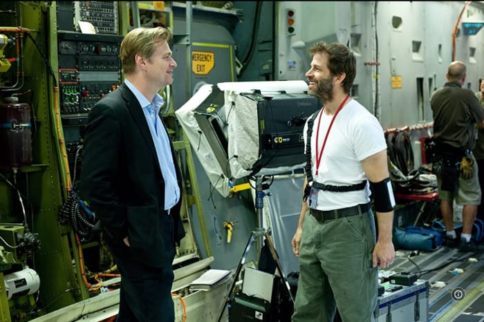 I couldn't find one including David S. Goyer, so imagine he's that piece of equipment standing behind Christopher Nolan and Zack Snyder.