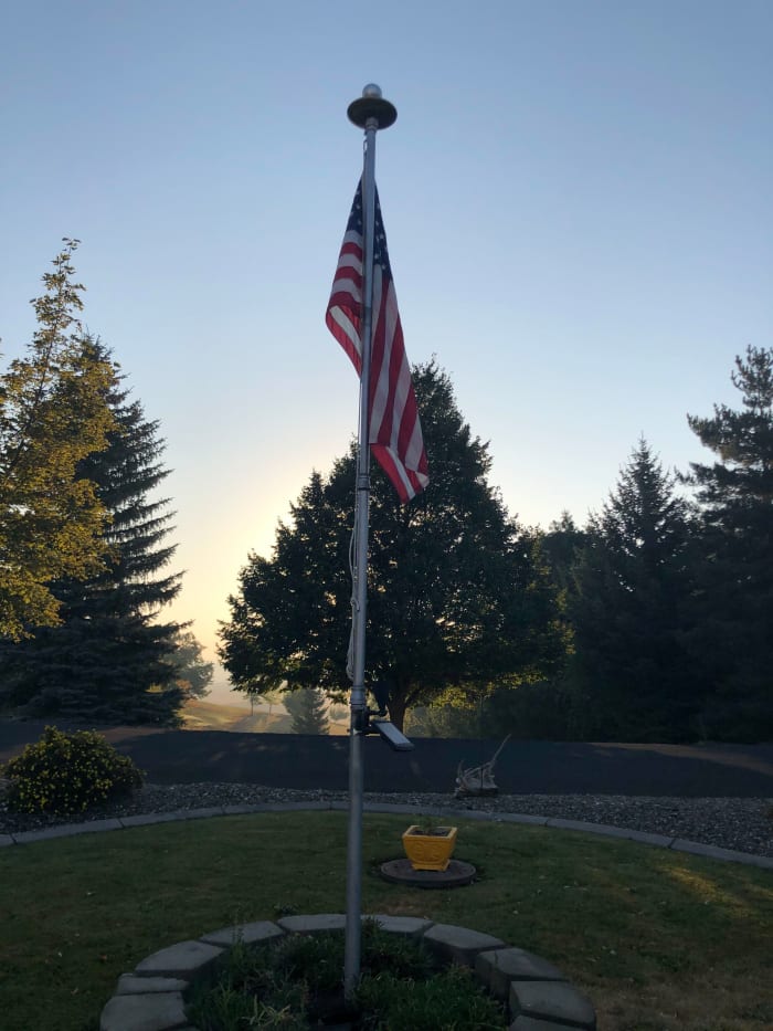 I took this picture of the flag and the flag pole in my front yard just after sunrise on the morning of 11 September 2020