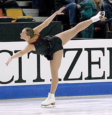 This is a move called the spiral. The skater's free leg must reach hip level or higher for it to be considered a good position. The most flexible skaters basically do a standing split.